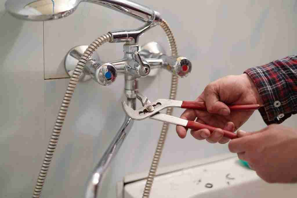 Plumber Fixing Water Tap